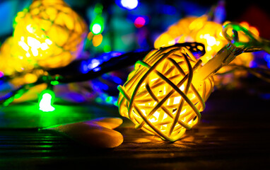 Obraz na płótnie Canvas Christmas lights close up photo. Cozy mood in the evening. Festive time. Holidays concept.