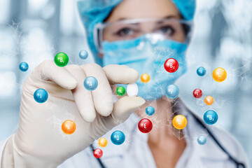 Doctor shows a pill containing a large amount of vitamins .