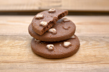 Chocolate cookies isolated on wood background