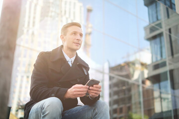 Handsome busyness man coffee time at sunny day in office district