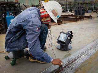 The inspectors are checking defect in welded of steel add joint with process Ultrasonic testing (UT) of Non-Destructive Testing(NDT) at industrial factory.