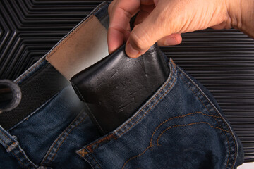 A pickpocket reaching wallet in victim pocket