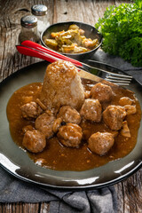 Minced meat balls in mushroom sauce.