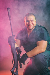 Soldier comes out of the smoke on the battlefield. The concept of military special operations....
