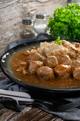 Minced meat balls in mushroom sauce.