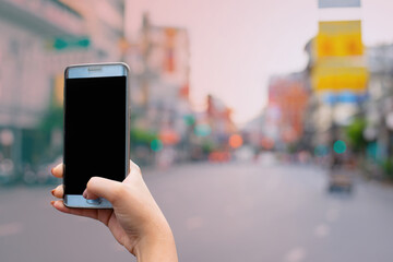 Black blank screen smart phone in lady hand