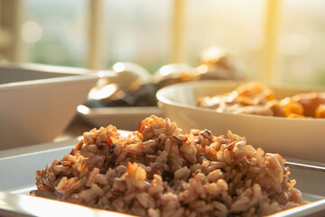 steamed brown rice with several side dish in the morning