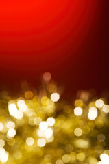Christmas and New Year holidays blurred golden sparkles on red background, abstract background with bokeh defocused glittering lights and shadow