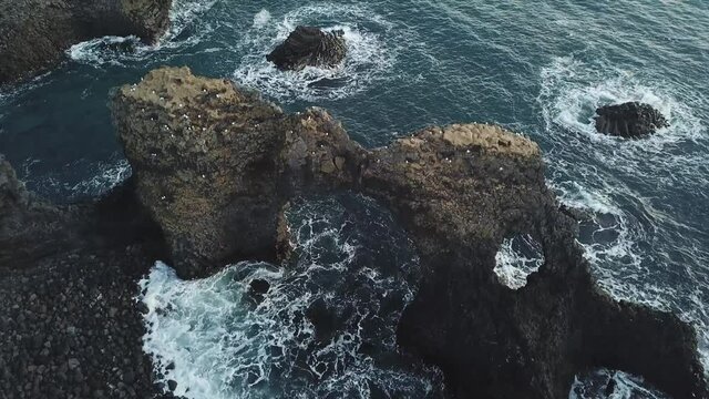 Gatklettur is a beautiful sea stack, a rock formation called the kissing rock at Arnarstapi on Snaefellsnes peninsula, West Iceland