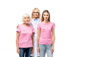 Doctor hugging women with pink ribbons on t-shirts isolated on white