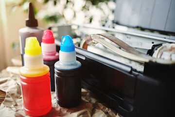 Refilling printer cartridges with multi-colored ink. Background