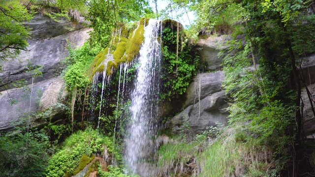 Naturalistic video of a magnificent hidden waterfall surrounded by nature