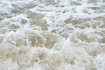 The  waves hit the shore at Ao Nang, Krabi, Thailand
