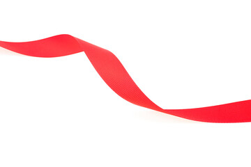 Red silk ribbon isolated on a white background, close up. Extending simple red ribbon. Red satin ribbon.