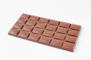 Milk chocolate bar isolated on white background