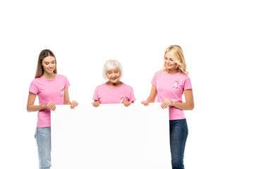 Women with ribbons of breast cancer awareness holding empty board isolated on white