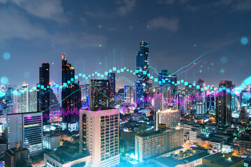 FOREX graph hologram, aerial night panoramic cityscape of Bangkok, the developed location for stock...