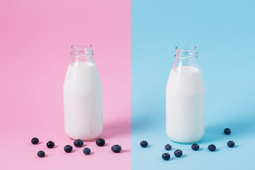 Milk in bottles on a colored background with berries. Concept. Healthy eating