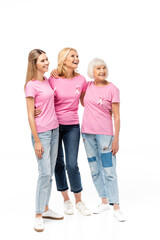 Fototapeta premium Women in pink t-shirts hugging and looking away isolated on white, concept of breast cancer