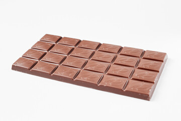 Milk chocolate bar isolated on white background