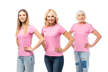 Women with hands on hips looking at camera isolated on white, concept of breast cancer awareness