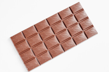 Milk chocolate bar isolated on white background