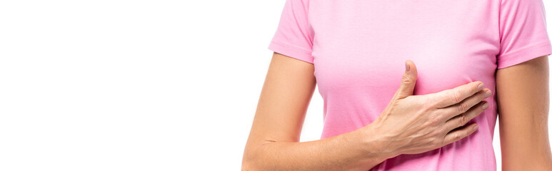 Horizontal image of woman in pink t-shirt with hand near breast isolated on white