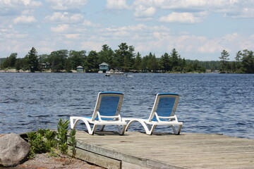 empty chairs by the lake