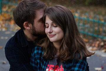 Fototapeta premium Couple kissing. Portrait of couple. Couple in love. Man and woman at the street. Couple are hugging.