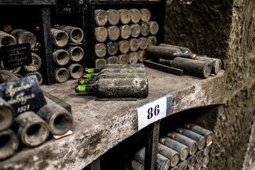 old bottles with wine stored in special cellars and stored using special technology