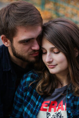 Portrait of couple. Couple in love. Man and woman at the street. Couple are hugging.