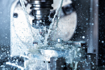 a process of vertical cnc steel milling with external water coolant streams and splashes
