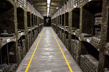 old bottles with wine stored in special cellars and stored using special technology