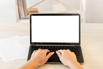 Working laptop. Freelance business. Remote job. Female hands typing on portable computer keyboard blank screen light interior background copy space.