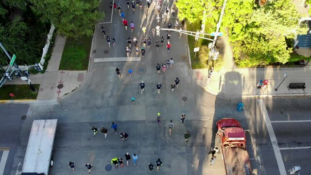 Marathon / 5K Runners at an Intersection on City Street