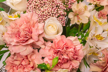 Bouquet of  soft pink flowers in wrapping paper.