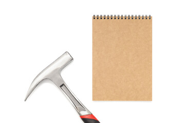 Notepad and hammer on a white background.