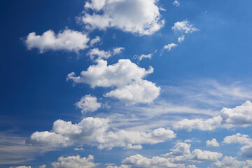 Naklejka na ściany i meble Blue sky background with clouds. Space for text