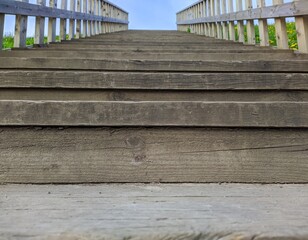 wooden staircase on the street leading up in the daytime in spring