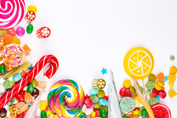 Colorful lollipops and different colored round candy. Top view.