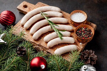 Christmas sausages on a background of stone with branches
Christmas trees, toys, gifts 