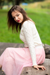 Portrait of a girl on a Park bench.