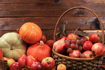 Happy Thanksgiving concept, postcard. Autumn background with seasonal pears, pumpkins, apples and flowers on wooden background, copy space, selective focus. Harvesting, gifts of nature