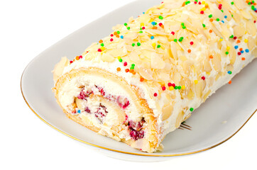 Sweet biscuit roll with cream on white background