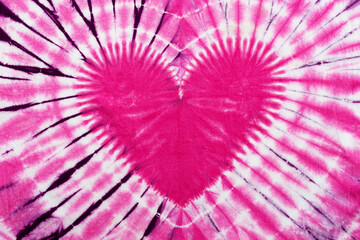 heart sign tie dye pattern on cotton fabric background.