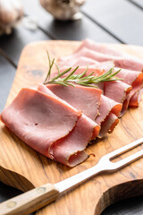 Sliced beef ham on cutting board