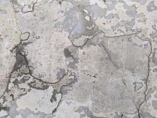 old and battered in places cracked white concrete