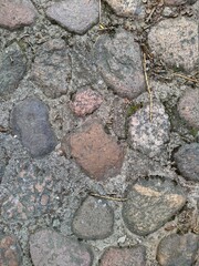 texture and background of stones rolled into the ground