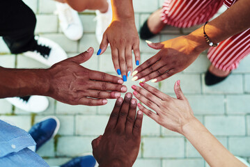 Black people with hands joined. Group of people stacking hands together