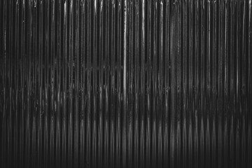 Dark corrugated metal or zinc texture surface or black galvanize steel industrial texture and...